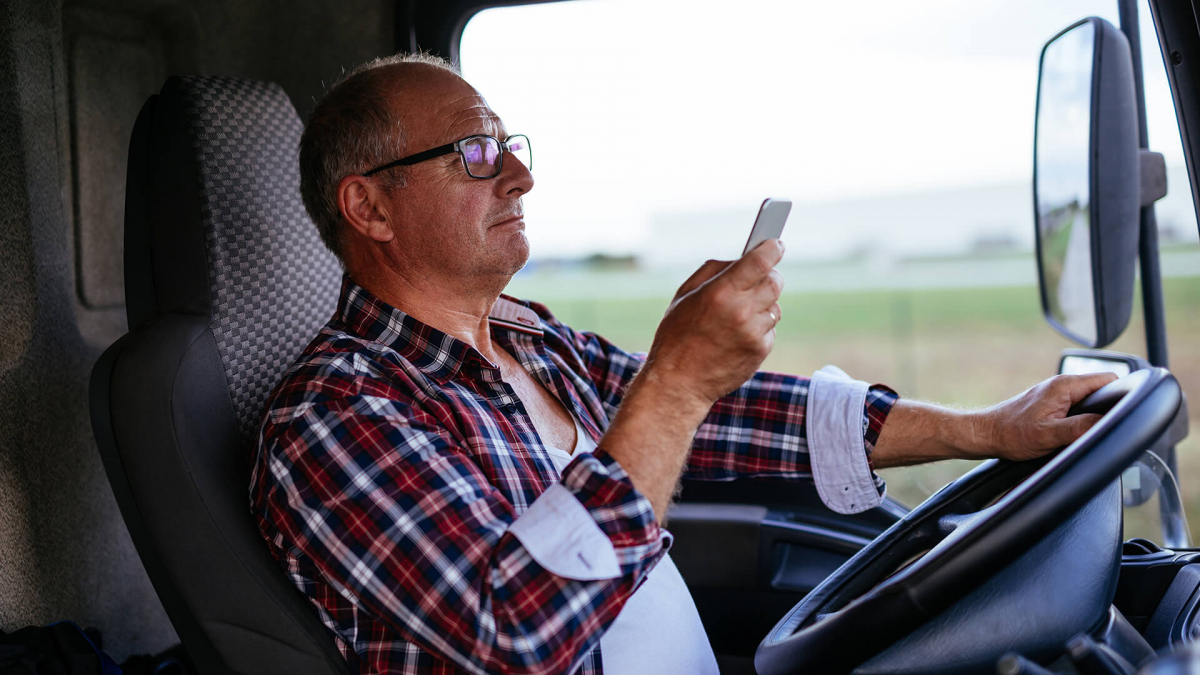 insight-mobile-data-safety-solutions-truck-driver-on-cell-phone-1920-1080.jpg